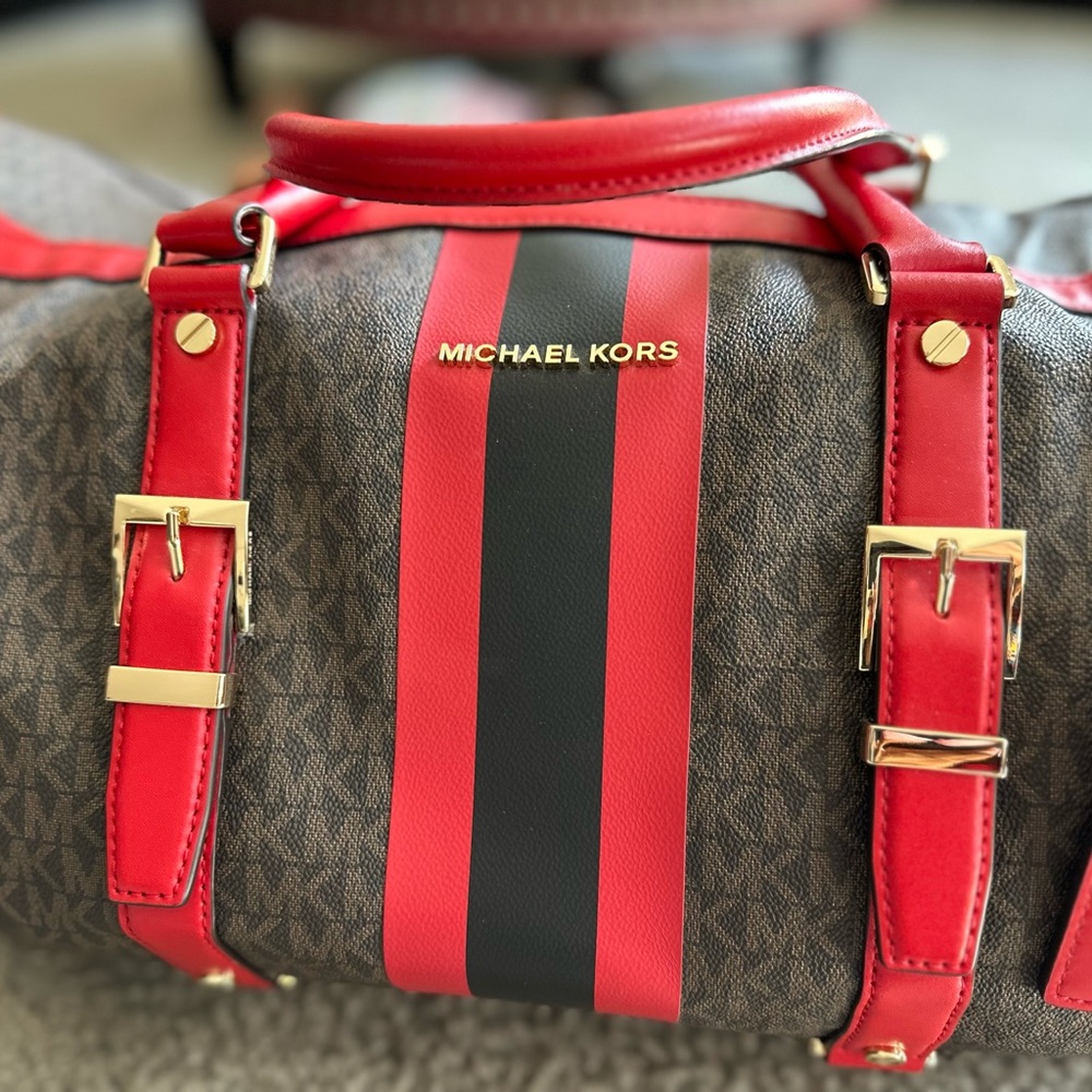 Michael Kors luxury duffle bag.suitcase is NO longer available.